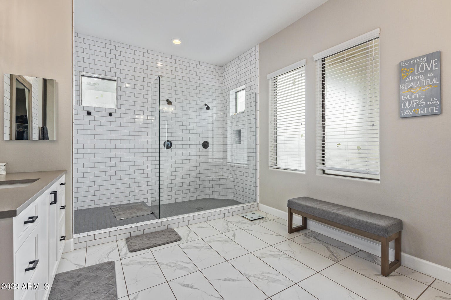 A luxury real estate property in Greater Scottsdale featuring a walk-in shower and bench, developed by Denali Development Construction.